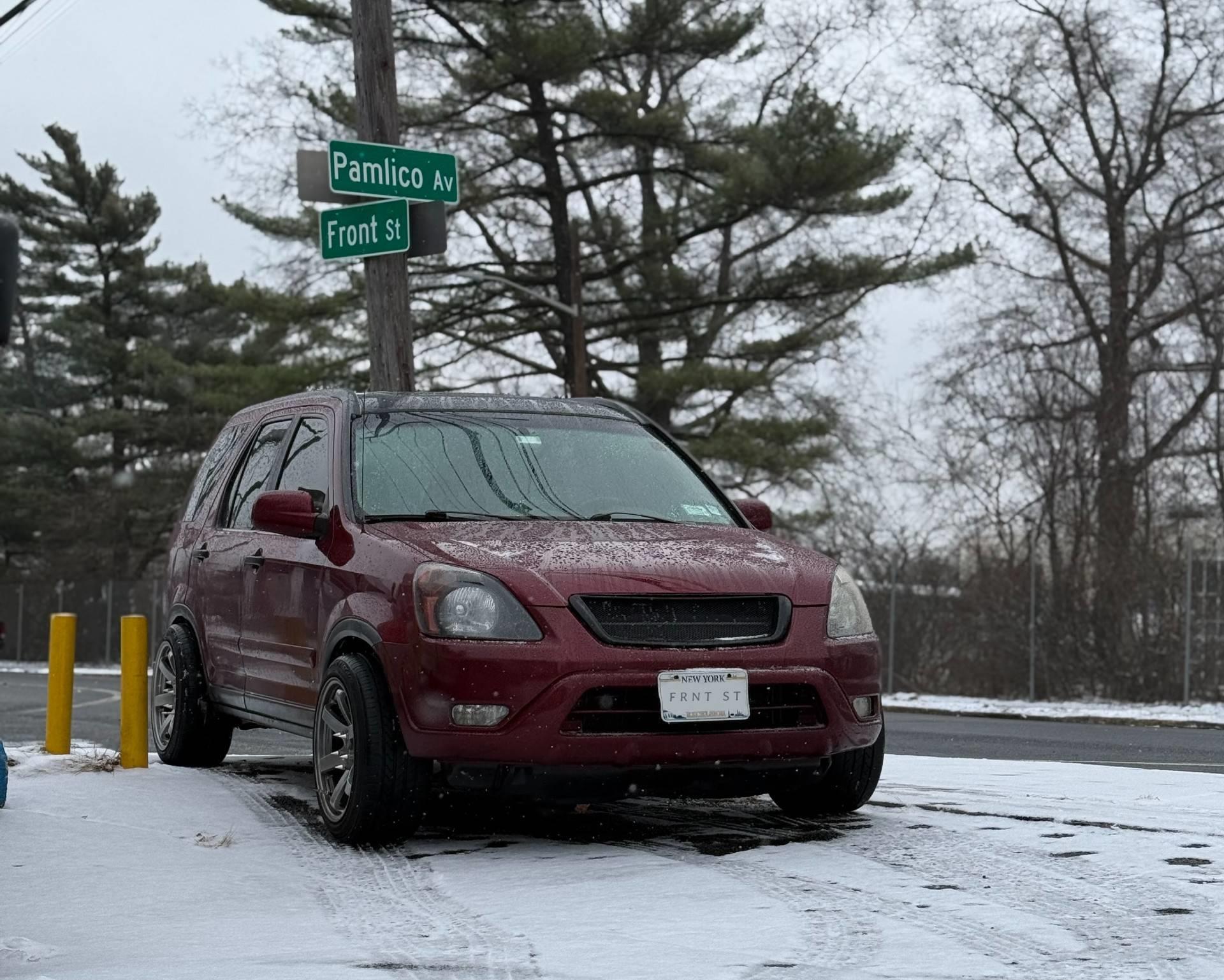 Red Honda CRV with new wheels and tires serviced by Front St Tires
