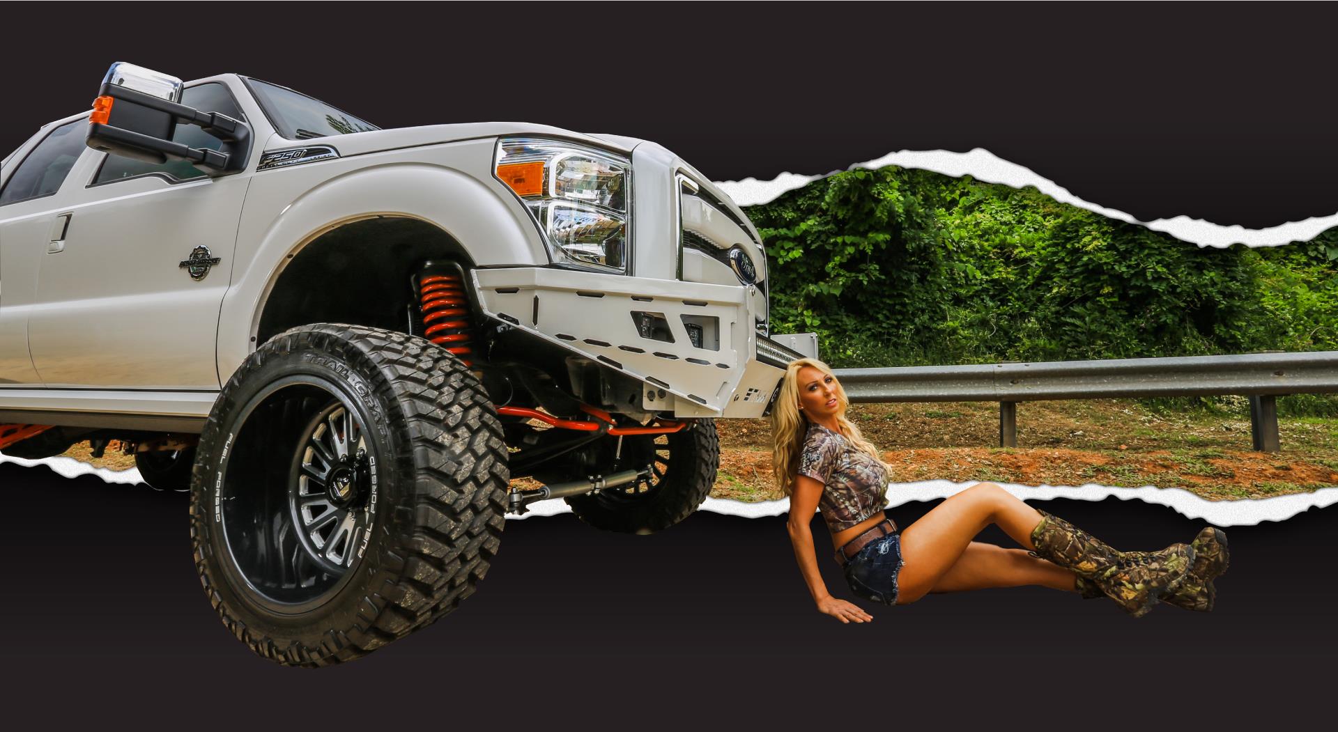 White truck with red lift kit