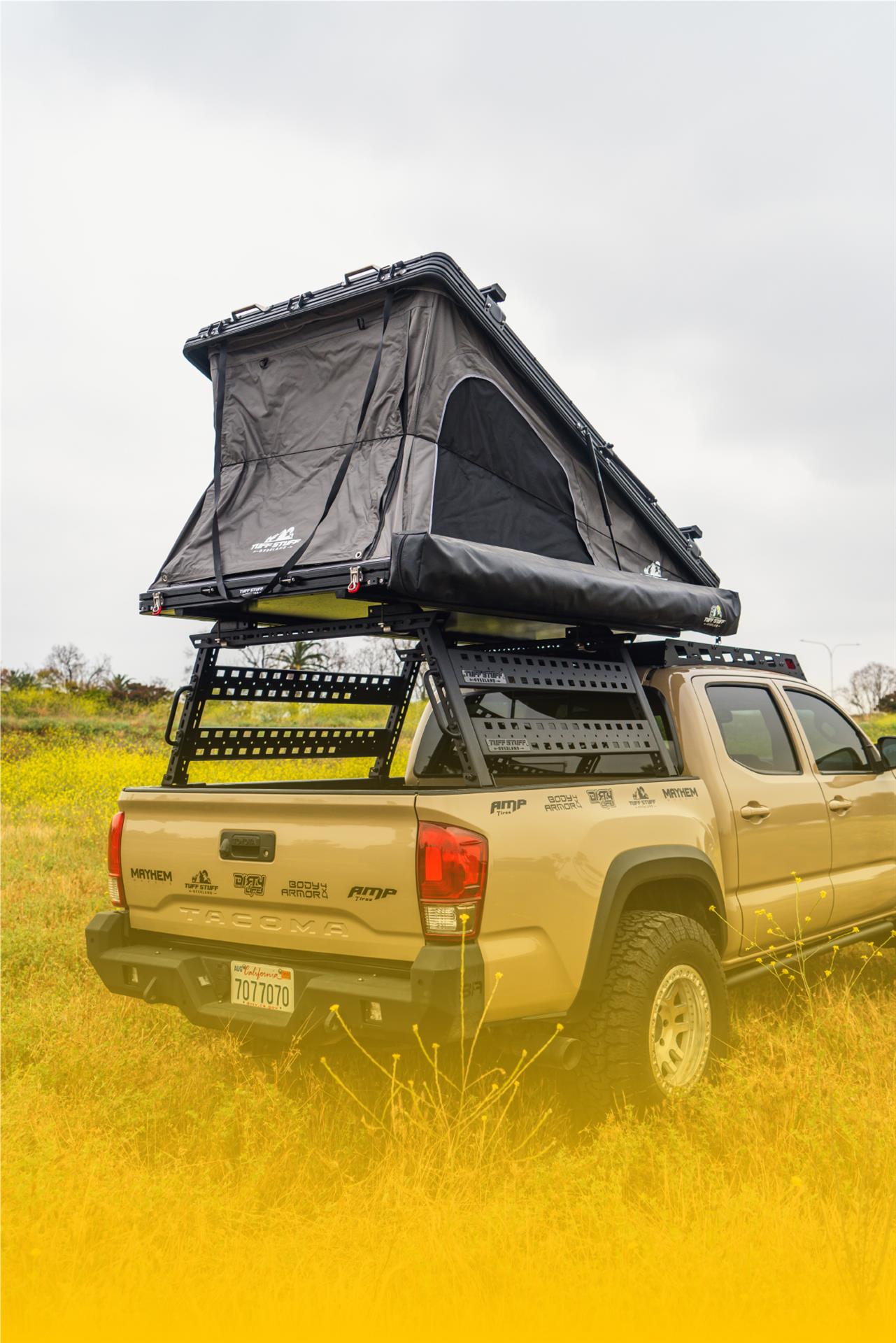 Tan tacoma with tent extension in bed