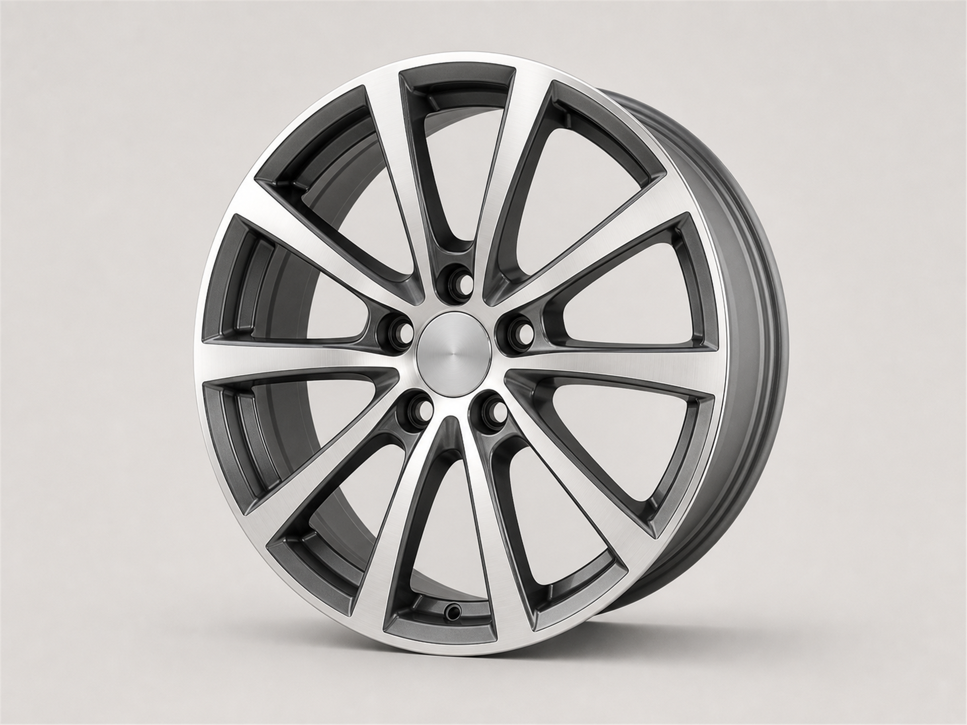 Unbranded machined-face automotive wheel with bright spoke faces and dark recessed pockets shown as a standalone studio product image on a light gray background.
