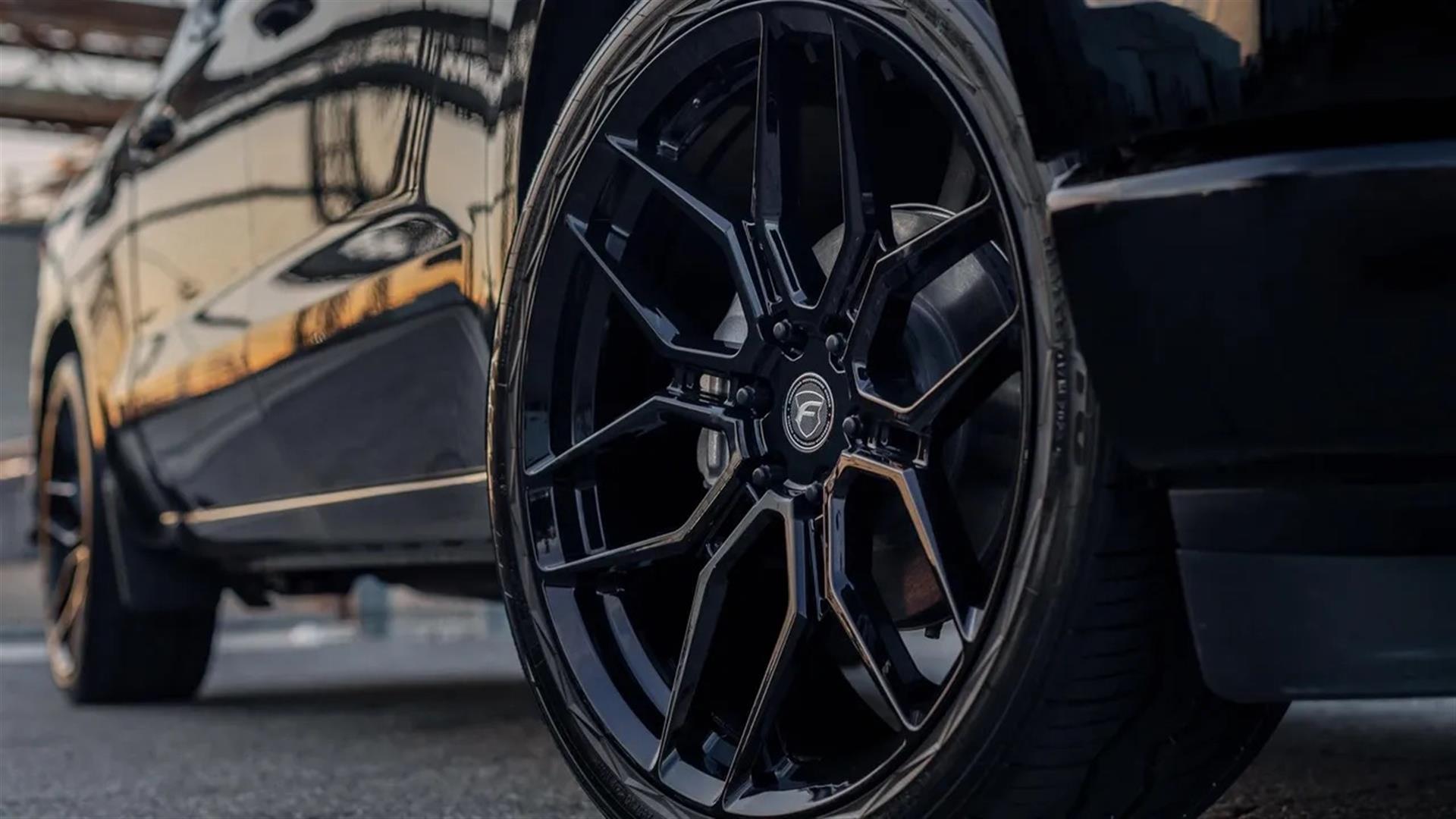 Black vehicle with Fittipaldi wheel