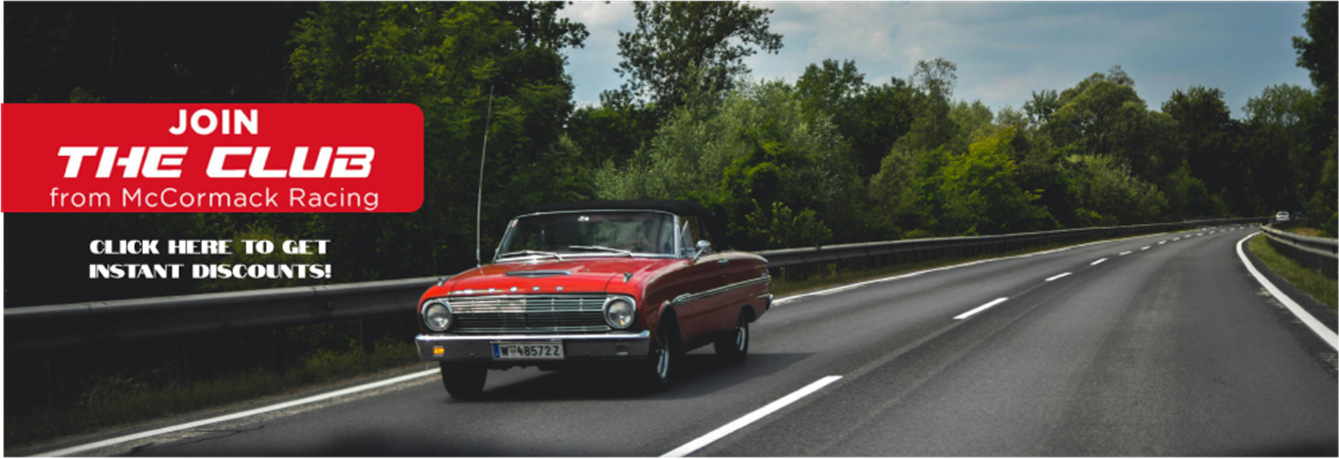 Red classic car on a forest highway - "JOIN THE CLUB!" 