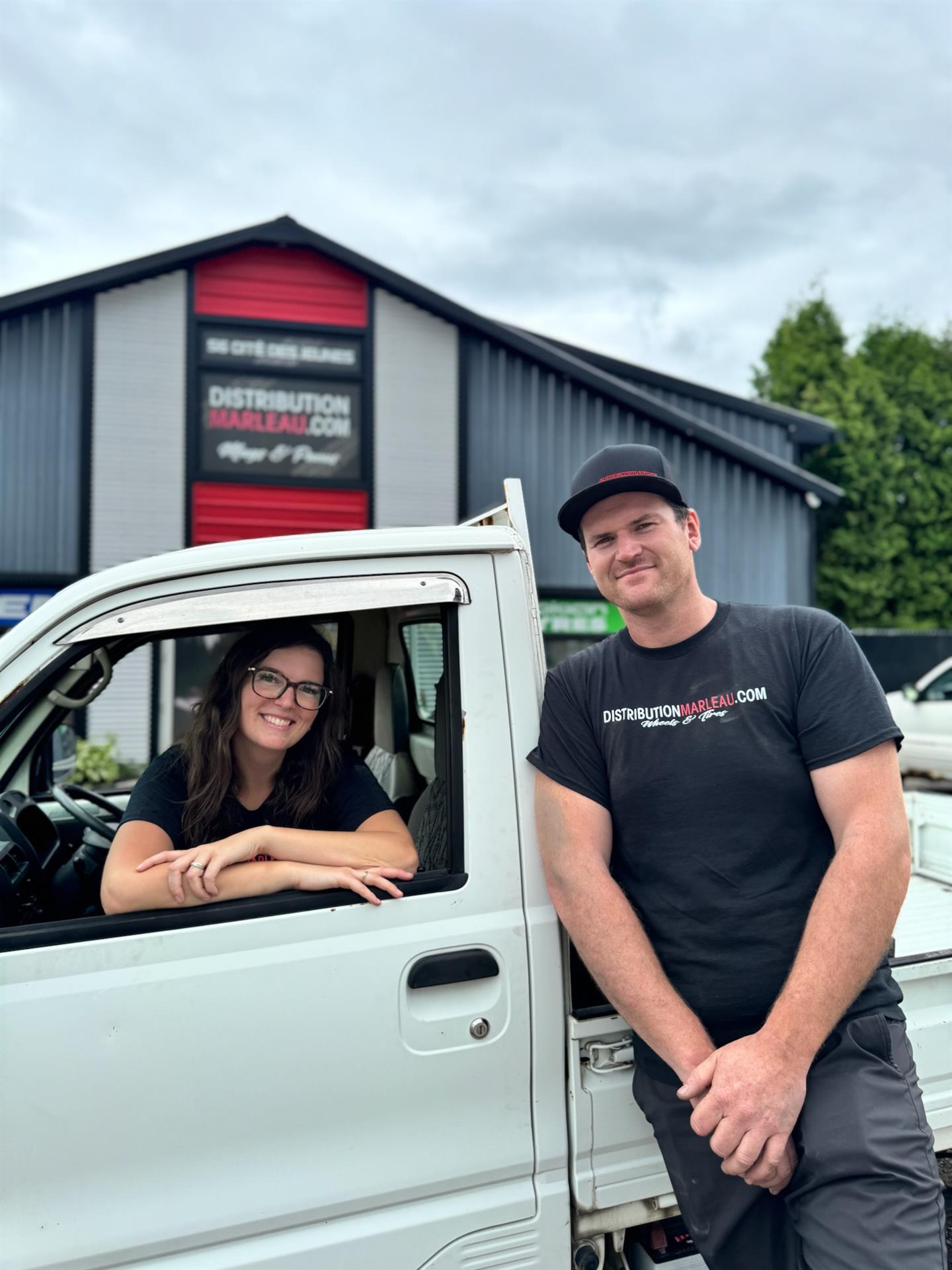 Distribution Marleau founders standing in front of Distribution Marleau warehouse