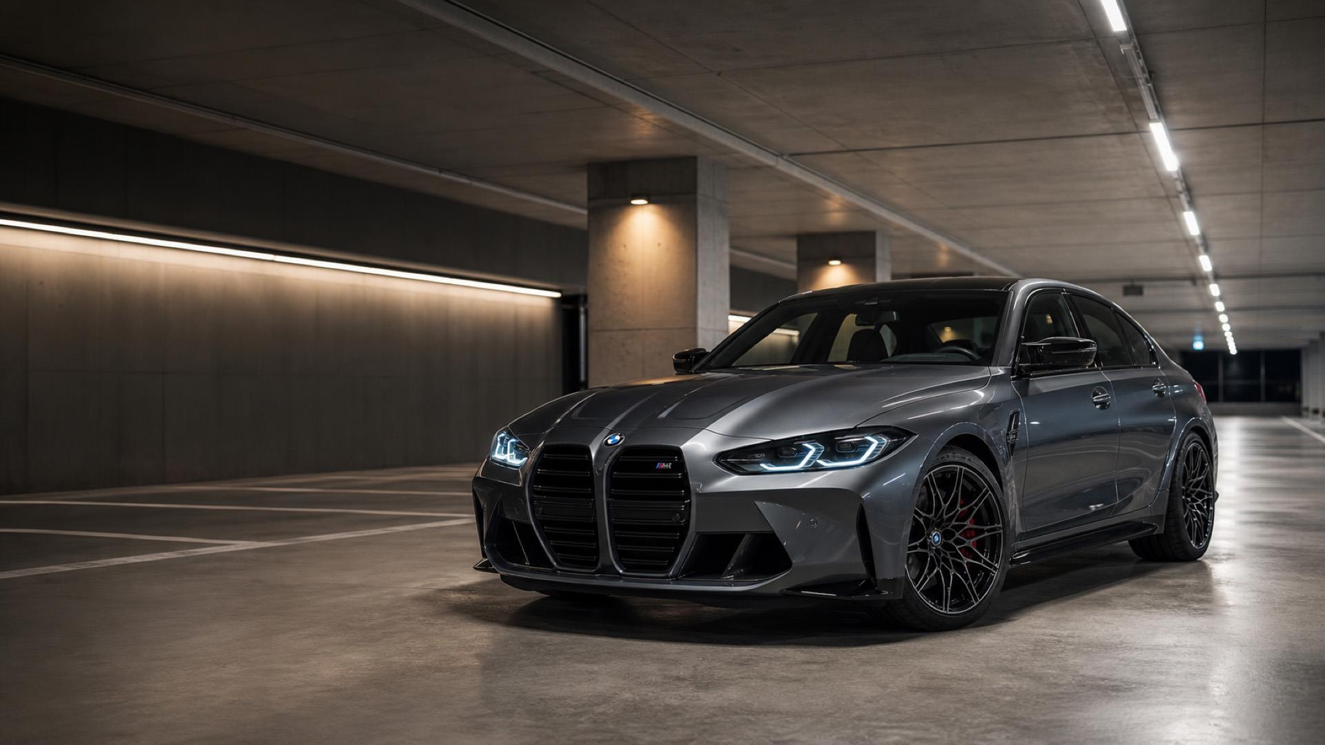 BMW M-series with custom wheels in a nicely lit parking garage